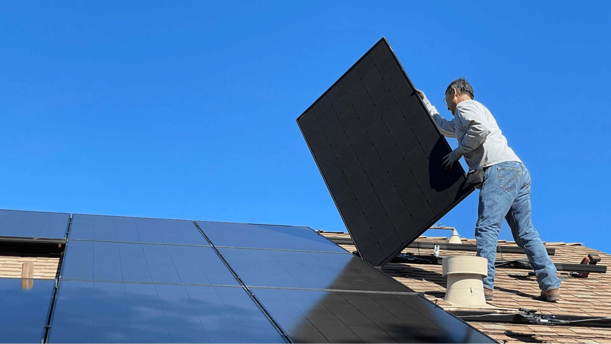 Technician installing solar panels.