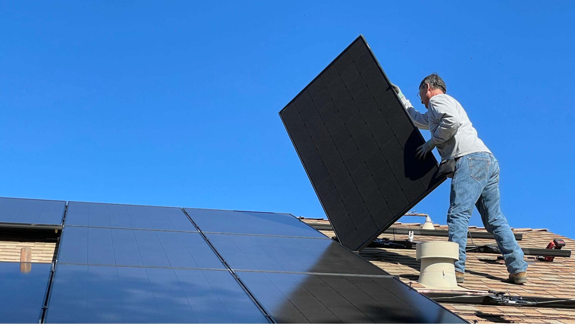 Technician installing solar panels.